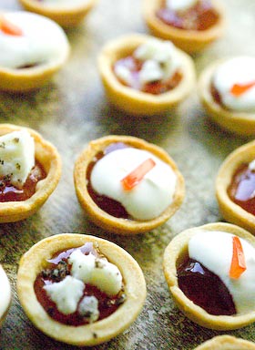 tomato jelly tarts served as a canape topped with sour cream