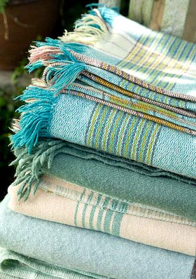 piles of blankets - it's time to wash them