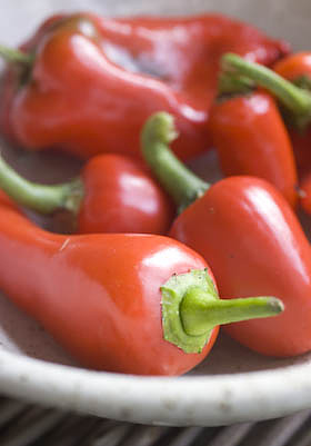 a selection of sweet red peppers and chillis