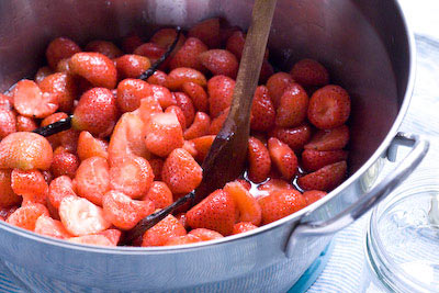 heating through the strawberries to release the syrup