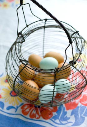 fresh eggs in a vintage French wire basket